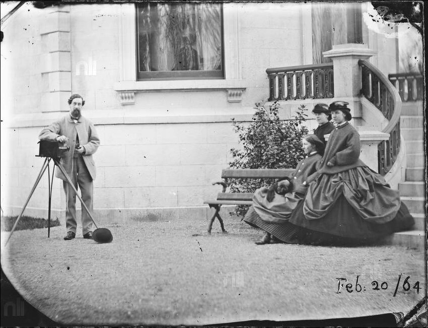 Lord Dunlo with stereo camera facing the three Dillon sisters at base of steps, Clonbrock House, Feb. 20th, 1864